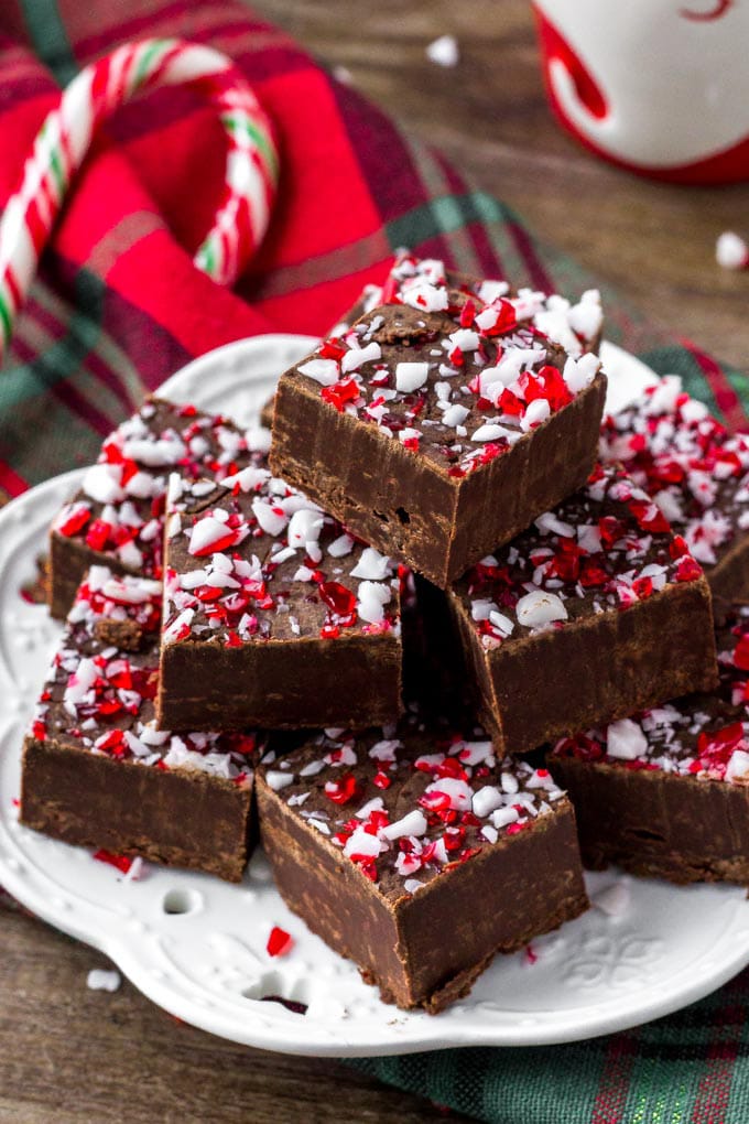 A stack of chocolate peppermint fudge with crushed candy canes