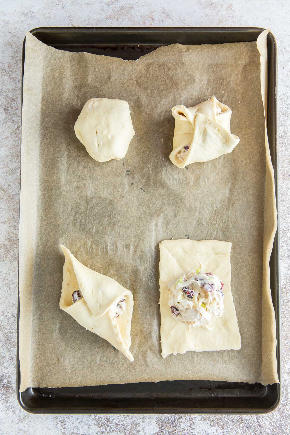 baking sheet, parchment paper, crescent roll dough, chicken salad