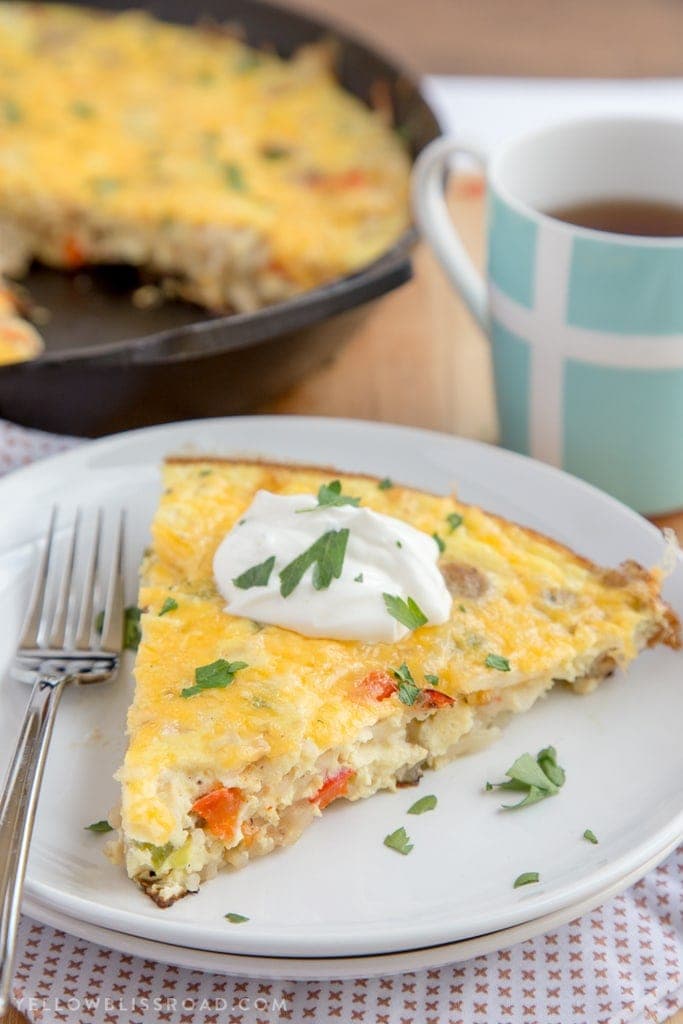 This Sausage & Potato Frittata filled with all the makings of a delicious, hearty breakfast - eggs, veggies, al fresco Country Style Chicken Sausage and Simply Potatoes Shredded Hash Browns - and all in one skillet for a quick and easy breakfast!