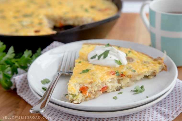 This Sausage & Potato Frittata filled with all the makings of a delicious, hearty breakfast - eggs, veggies, al fresco Country Style Chicken Sausage and Simply Potatoes Shredded Hash Browns - and all in one skillet for a quick and easy breakfast!