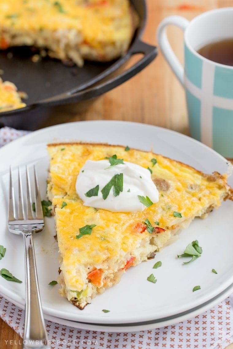 This Sausage & Potato Frittata filled with all the makings of a delicious, hearty breakfast - eggs, veggies, al fresco Country Style Chicken Sausage and Simply Potatoes Shredded Hash Browns - and all in one skillet for a quick and easy breakfast!