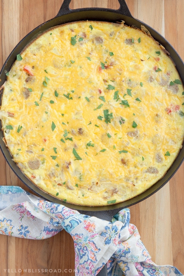 This Sausage & Potato Frittata filled with all the makings of a delicious, hearty breakfast - eggs, veggies, al fresco Country Style Chicken Sausage and Simply Potatoes Shredded Hash Browns - and all in one skillet for a quick and easy breakfast!