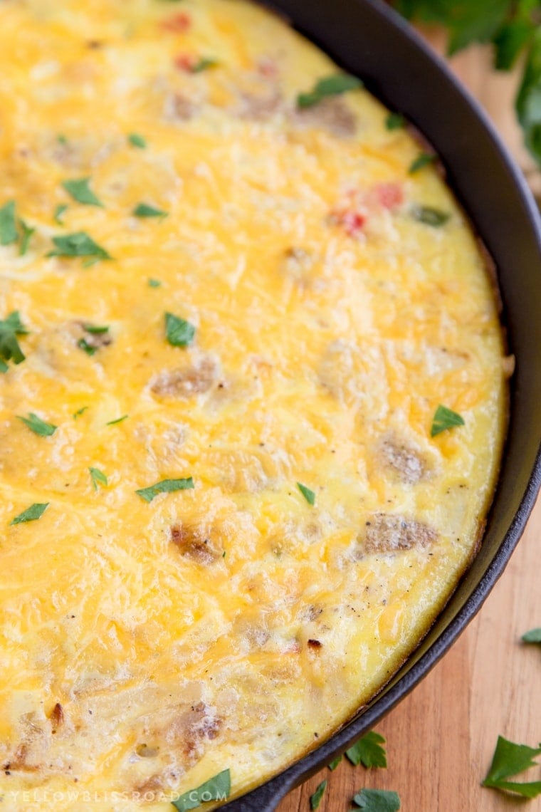 This Sausage & Potato Frittata filled with all the makings of a delicious, hearty breakfast - eggs, veggies, al fresco Country Style Chicken Sausage and Simply Potatoes Shredded Hash Browns - and all in one skillet for a quick and easy breakfast!