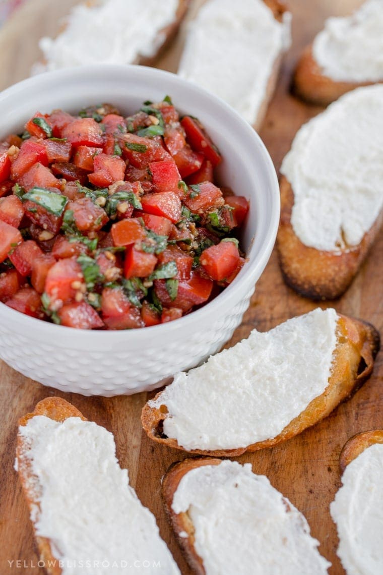 Creamy Three Cheese Bruschetta with Goat Cheese, Cream Cheese and Parmesan. An elegant and classy appetizer that everyone will love!