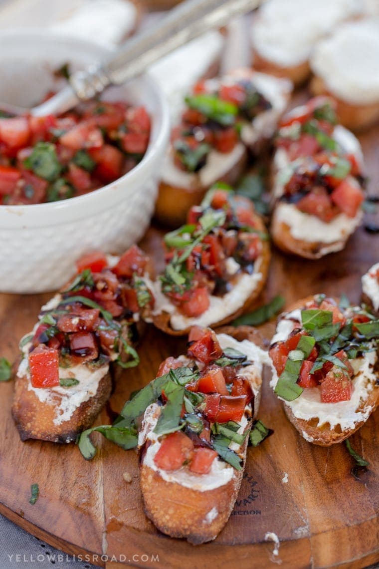 Creamy Three Cheese Bruschetta with Goat Cheese, Cream Cheese and Parmesan. An elegant and classy appetizer that everyone will love!