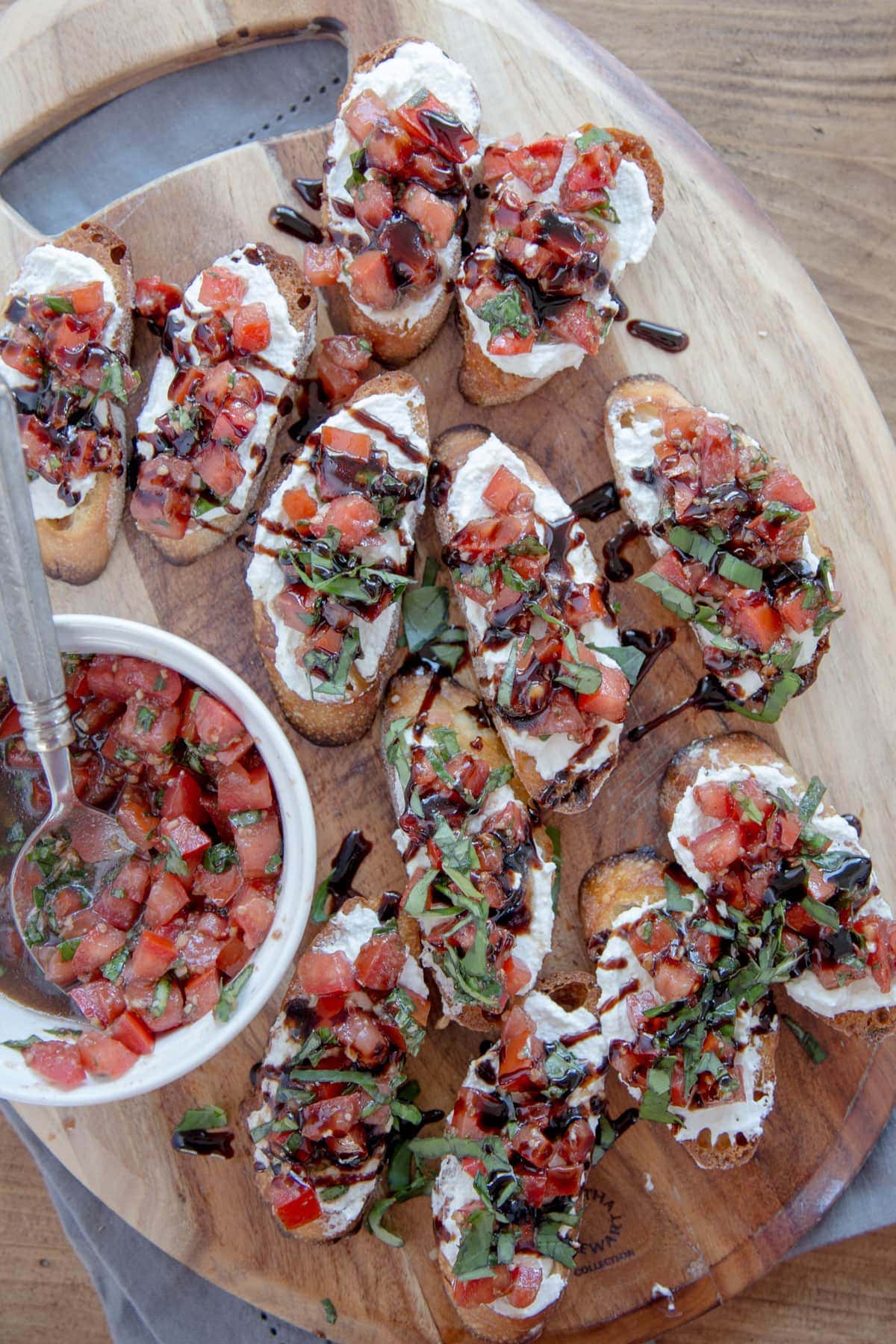 Creamy Three Cheese Bruschetta with Goat Cheese, Cream Cheese and Parmesan. An elegant and classy appetizer that everyone will love!