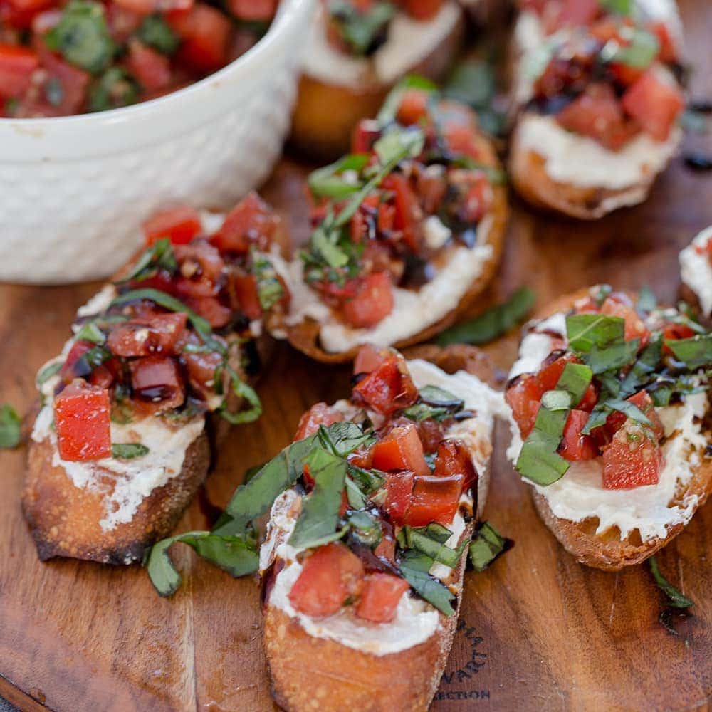 Creamy Three Cheese Bruschetta with Goat Cheese, Cream Cheese and Parmesan. An elegant and classy appetizer that everyone will love!