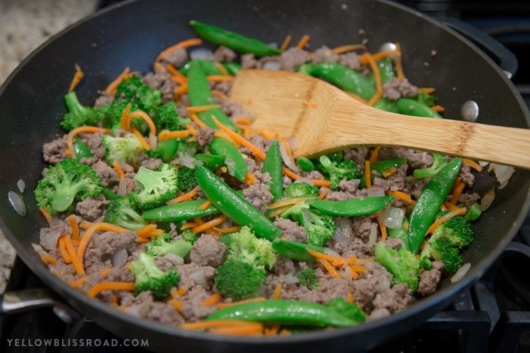 Ground beef and vegetables in a skillet