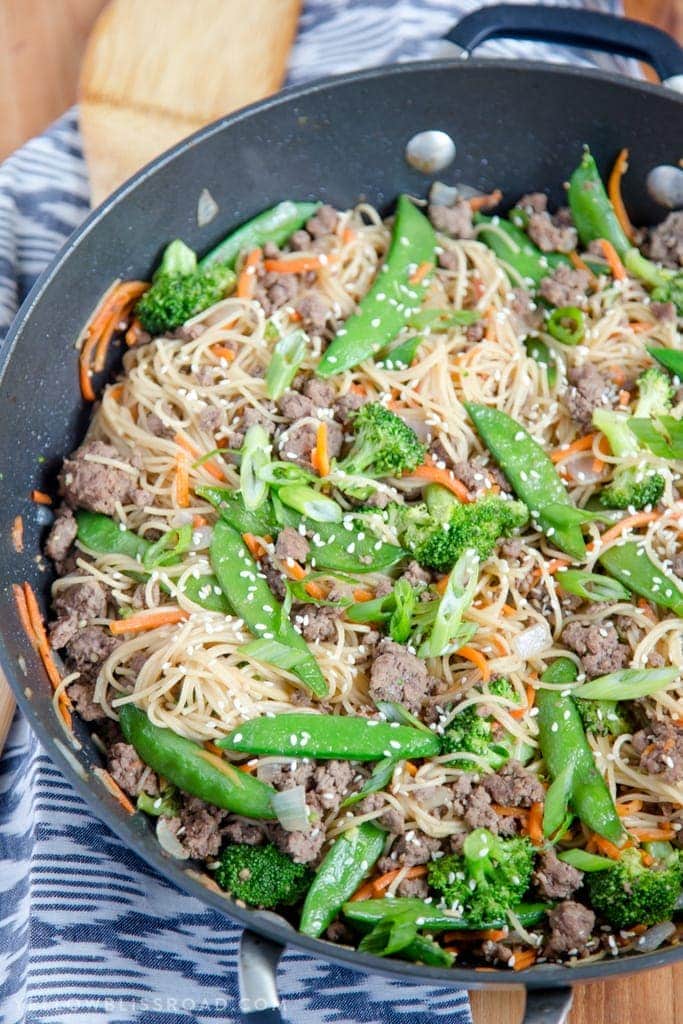 A skillet filled with noodles, ground beef and vegetables