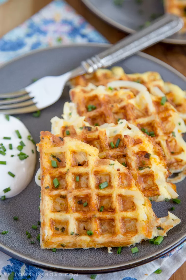 A plate of crispy Egg & Cheese Hash Brown Waffles