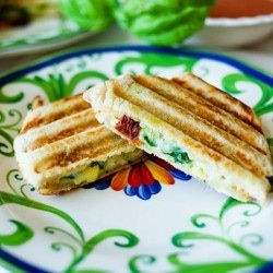 Make this comforting Mediterranean Panini with pesto, artichokes, and sun-dried tomatoes.