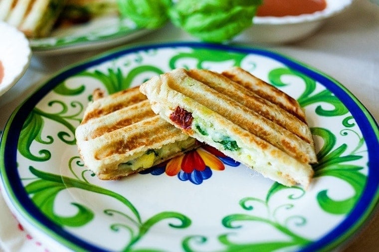 Easily make this Mediterranean Panini with the flavors of sun-dried tomatoes, artichokes, pesto, and more! The perfect sandwich when you want to switch things up!