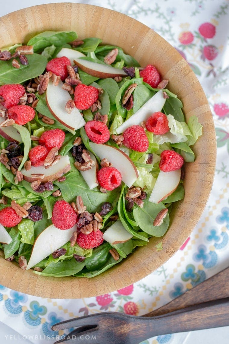 Raspberry & Pear Salad with Homemade Raspberry Vinaigrette - An easy and delicious Salad that is the perfect compliment to any holiday meal.
