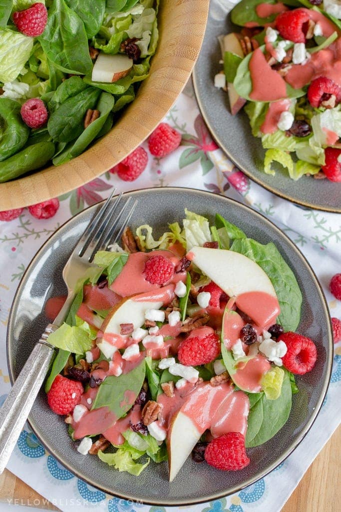 Raspberry & Pear Salad with Homemade Raspberry Vinaigrette - An easy and delicious Salad that is the perfect compliment to any holiday meal.