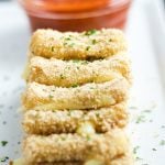 A close up of baked mozzarella sticks