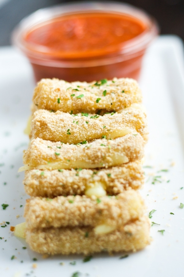 Baked Mozzarella Sticks- Easy, quick and healthier too! Enjoy these baked mozzarella sticks for any occasion or party.