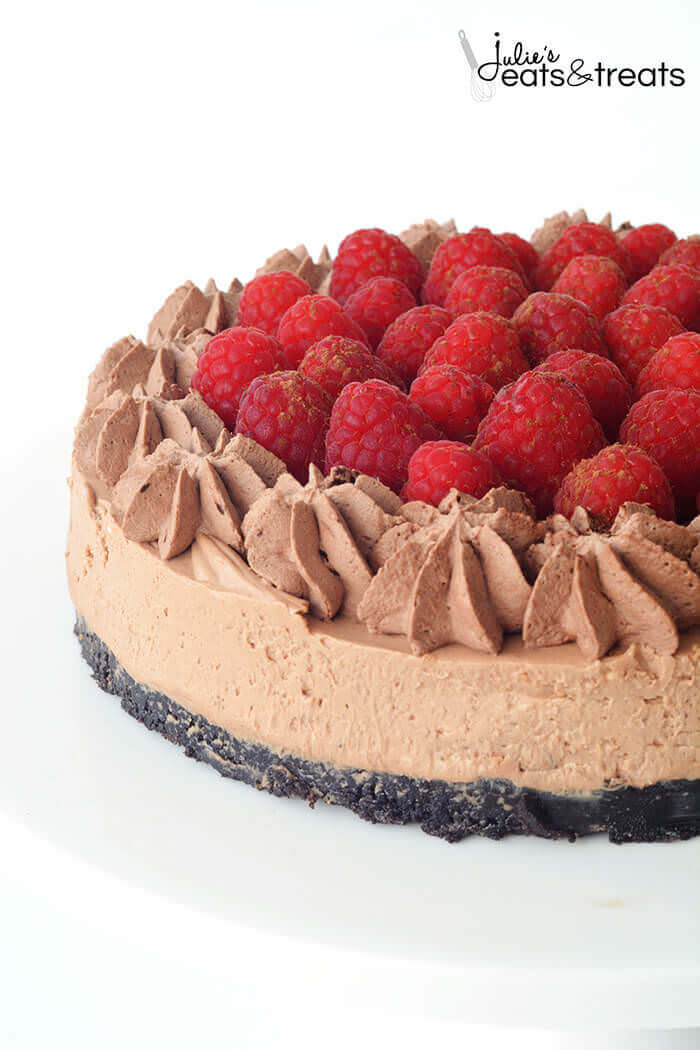 A chocolate cake with raspberries