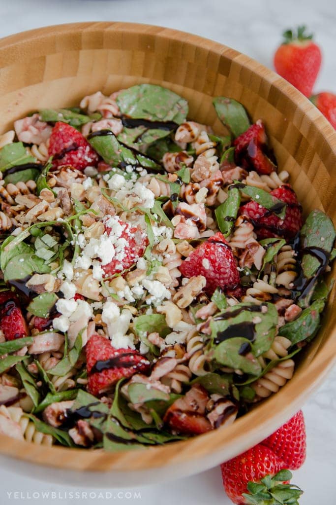 This Balsamic Strawberry Pasta Salad with chicken, pasta, basil, spinach, sweet strawberries, and a tangy Strawberry Balsamic Vinaigrette.