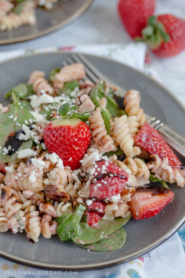 This Balsamic Strawberry Pasta Salad with chicken, pasta, basil, spinach, sweet strawberries, and a tangy Strawberry Balsamic Vinaigrette.