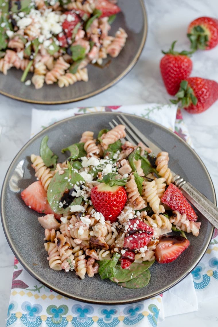 This Balsamic Strawberry Pasta Salad with chicken, pasta, basil, spinach, sweet strawberries, and a tangy Strawberry Balsamic Vinaigrette.