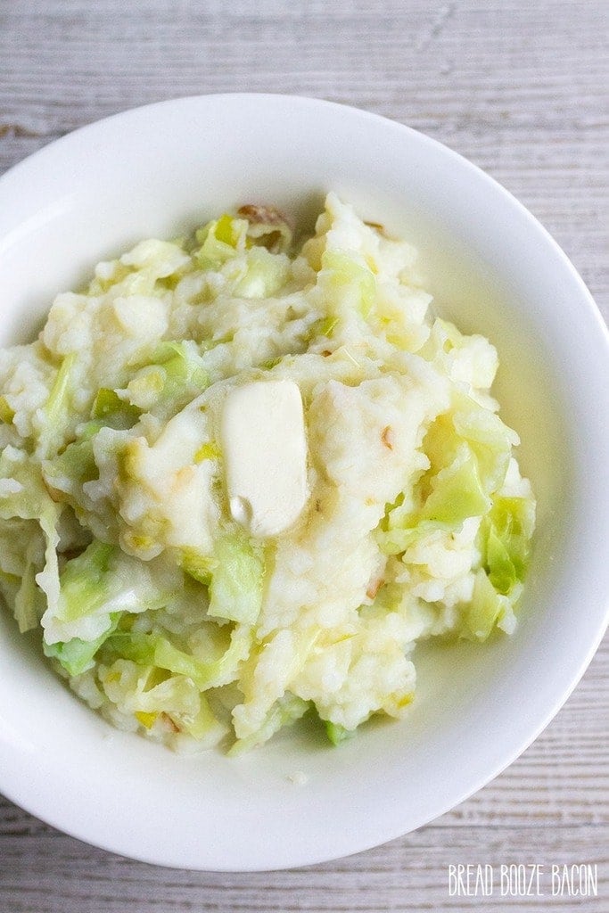 A large bowl of Colcannon - Irish Mashed Potatoes with Leeks and Cabbage.