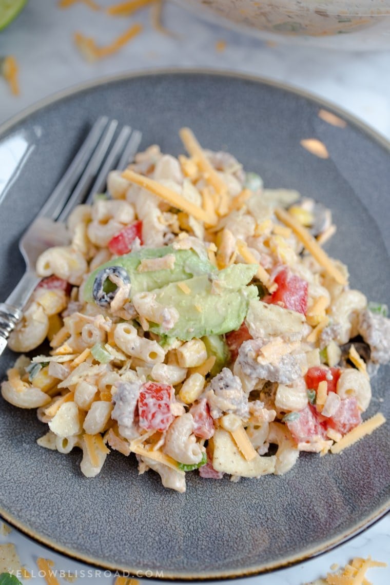 Creamy Taco Pasta Salad with pasta, ground beef and all of your favorite taco fillings. For Taco Tuesday dinner, picnics and potlucks.