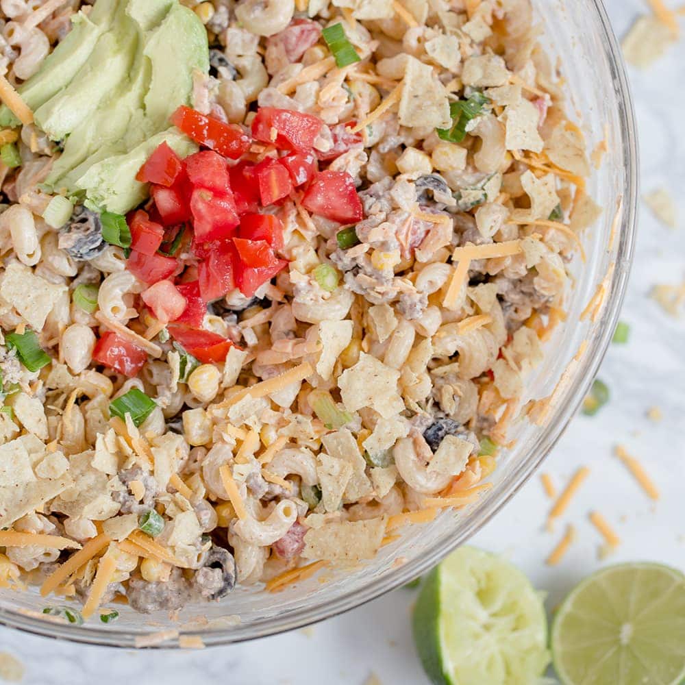 Creamy Taco Pasta Salad with pasta, ground beef and all of your favorite taco fillings. For Taco Tuesday dinner, picnics and potlucks.