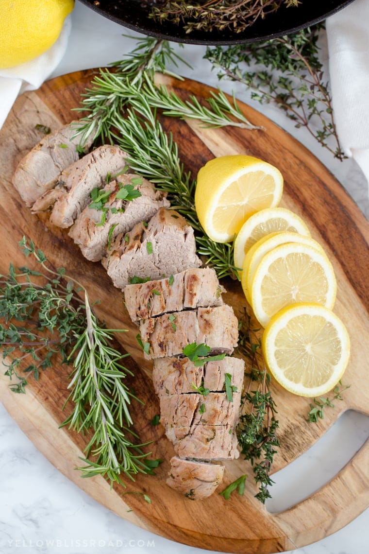 Sliced pork tenderloin on a cutting board