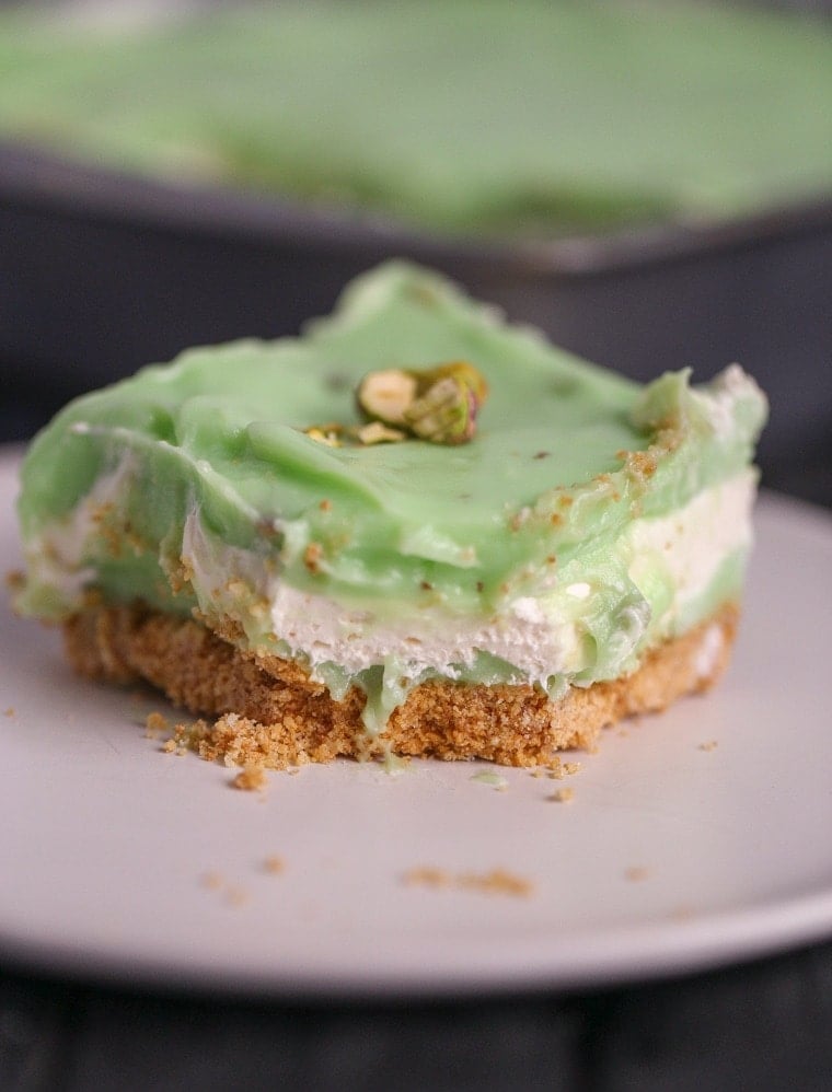 An easy Pistachio Icebox Cake that is layers of goodness. The cake is made with graham crackers, pistachio pudding and lots of whipped topping!