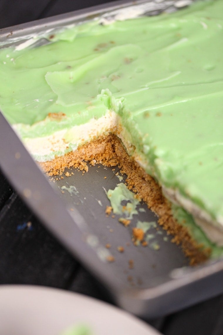 An easy Pistachio Icebox Cake that is layers of goodness. The cake is made with graham crackers, pistachio pudding and lots of whipped topping!