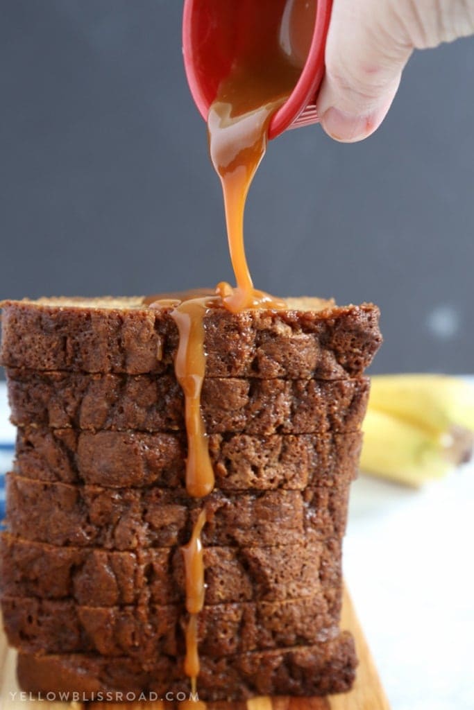 This Caramel Banana Bread is full of tasty bananas and delicious sweet caramel. Finished with a drizzle of caramel, it's a decadent quick bread that makes a delicious dessert or snack.