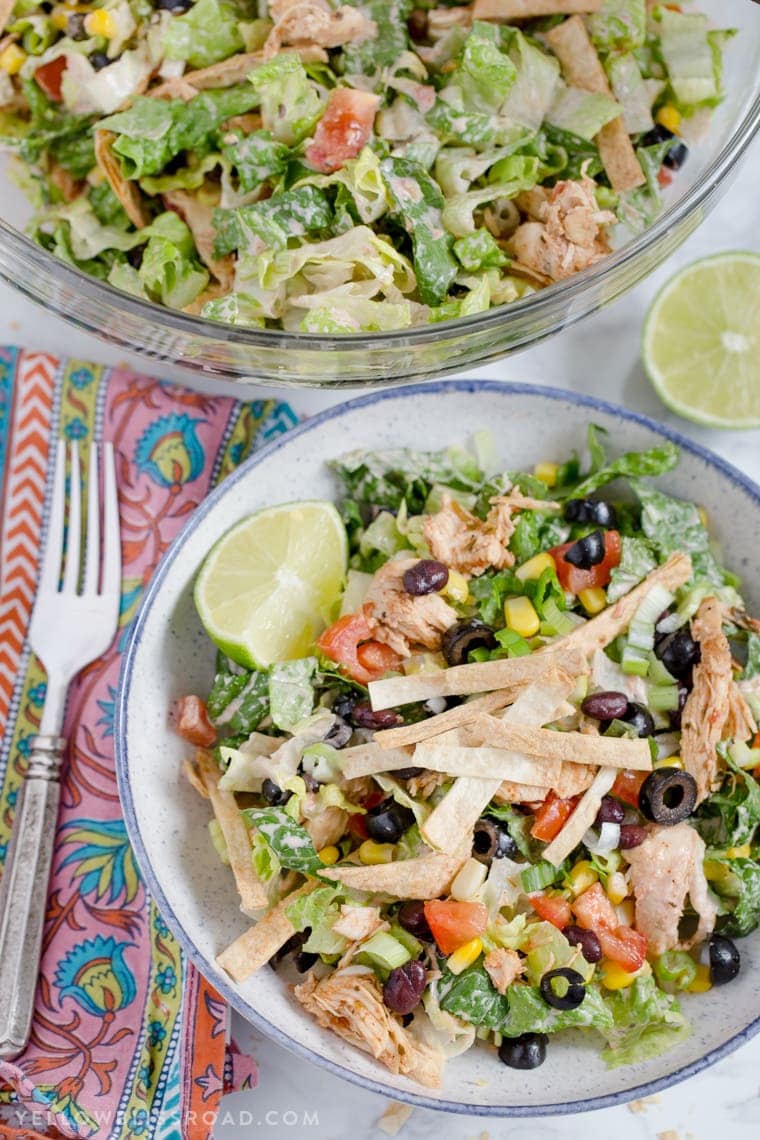 This Chicken Taco Salad is a delicious, quick and easy Mexican dinner that has all your favorite taco toppings with a spicy cream Salsa Ranch Dressing. 