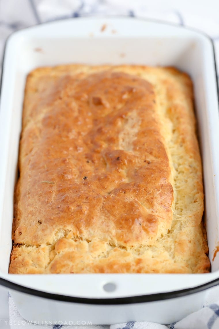 This Parmesan Garlic Herb Quick Bread is a tender, flavorful, savory quick bread that makes a great side dish to any meal.