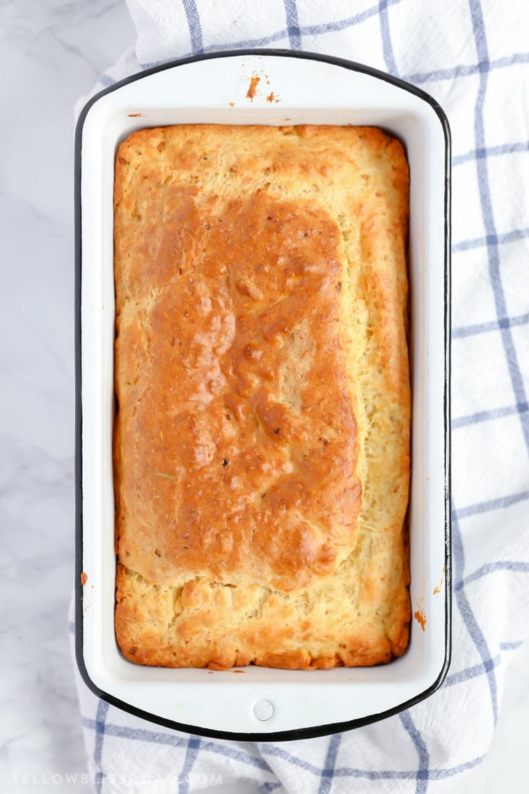 This Parmesan Garlic Herb Quick Bread is a tender, flavorful, savory quick bread that makes a great side dish to any meal.