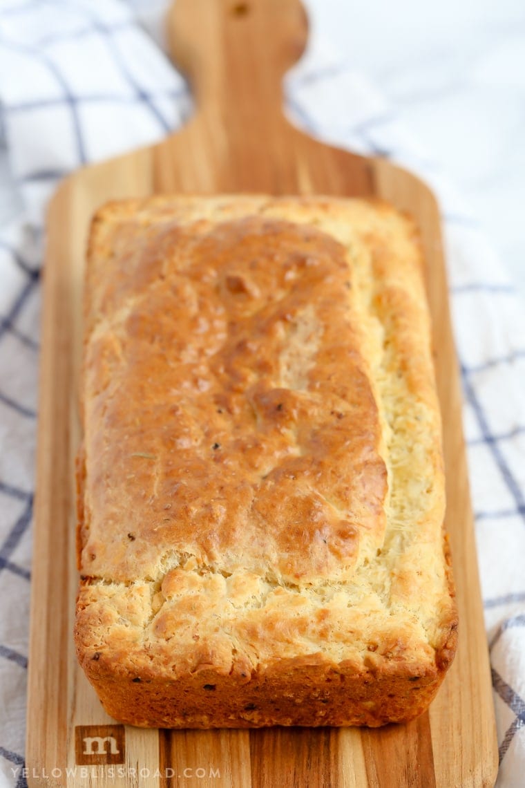 This Parmesan Garlic Herb Quick Bread is a tender, flavorful, savory quick bread that makes a great side dish to any meal.