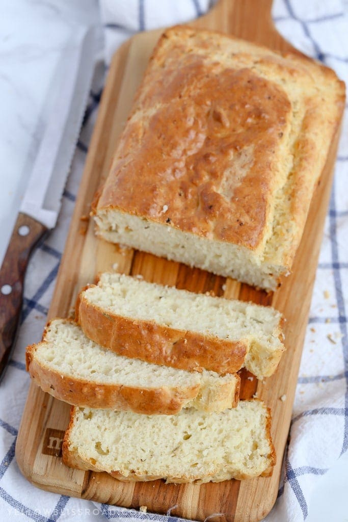 This Parmesan Garlic Herb Quick Bread is a tender, flavorful, savory quick bread that makes a great side dish to any meal.