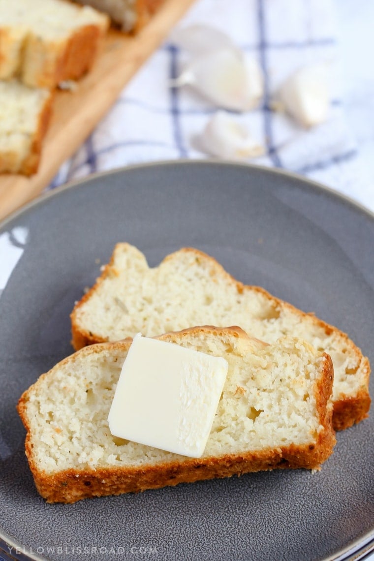 This Parmesan Garlic Herb Quick Bread is a tender, flavorful, savory quick bread that makes a great side dish to any meal.