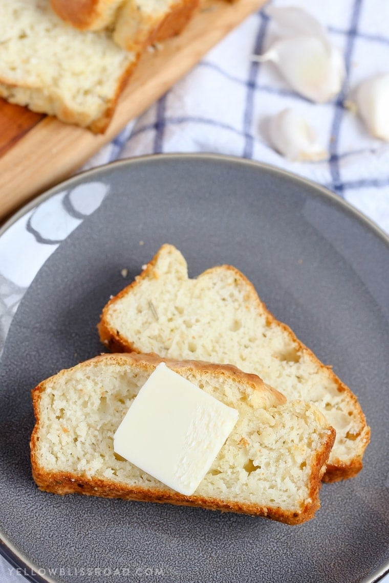 This Parmesan Garlic Herb Quick Bread is a tender, flavorful, savory quick bread that makes a great side dish to any meal.