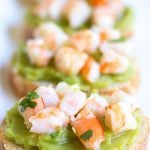 Guacamole Shrimp Bruschetta is an easy, 10-minute appetizer that's full of flavor and perfect for parties!