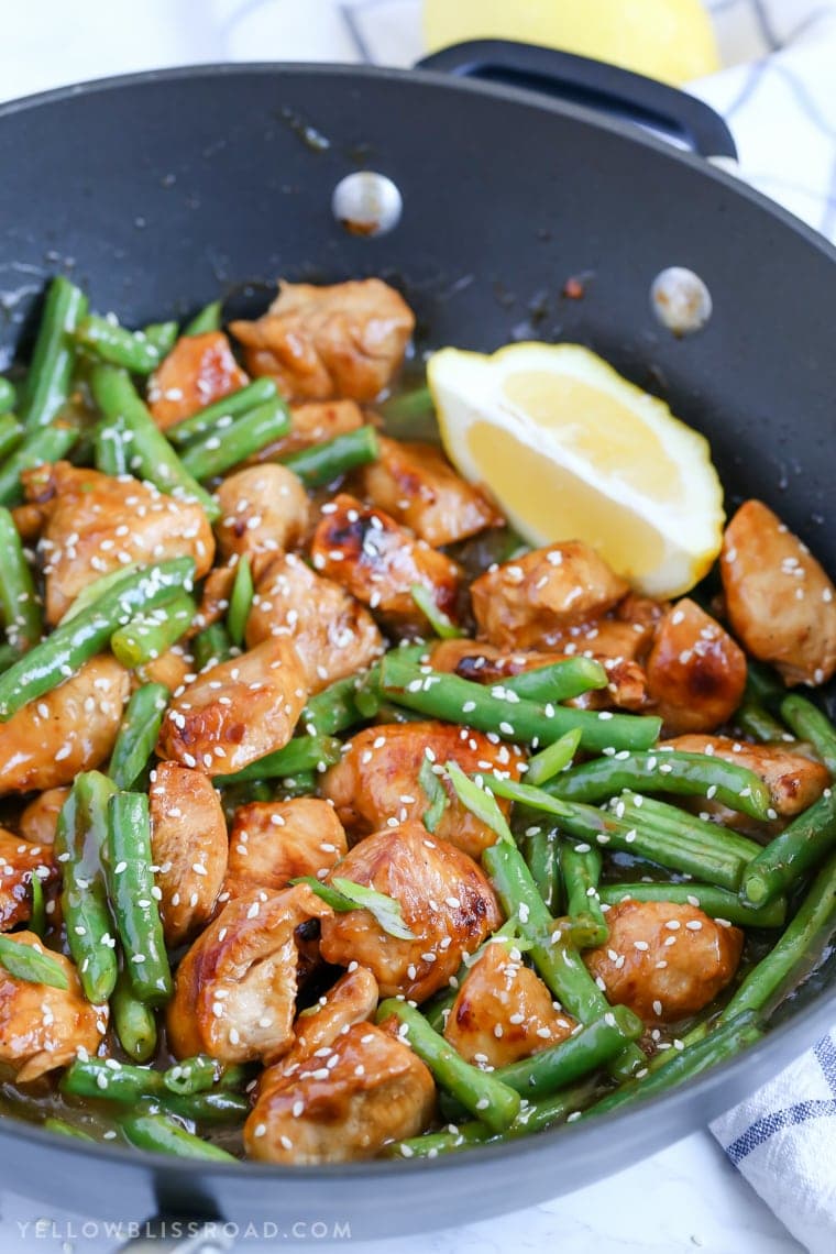 This Honey Lemon Chicken and Green Beans Stir Fry is a light and fresh meal with a ton of flavor. Dinner is on the table in just 20 minutes! Honey Lemon Chicken and Green Beans Stir fry in a skillet.