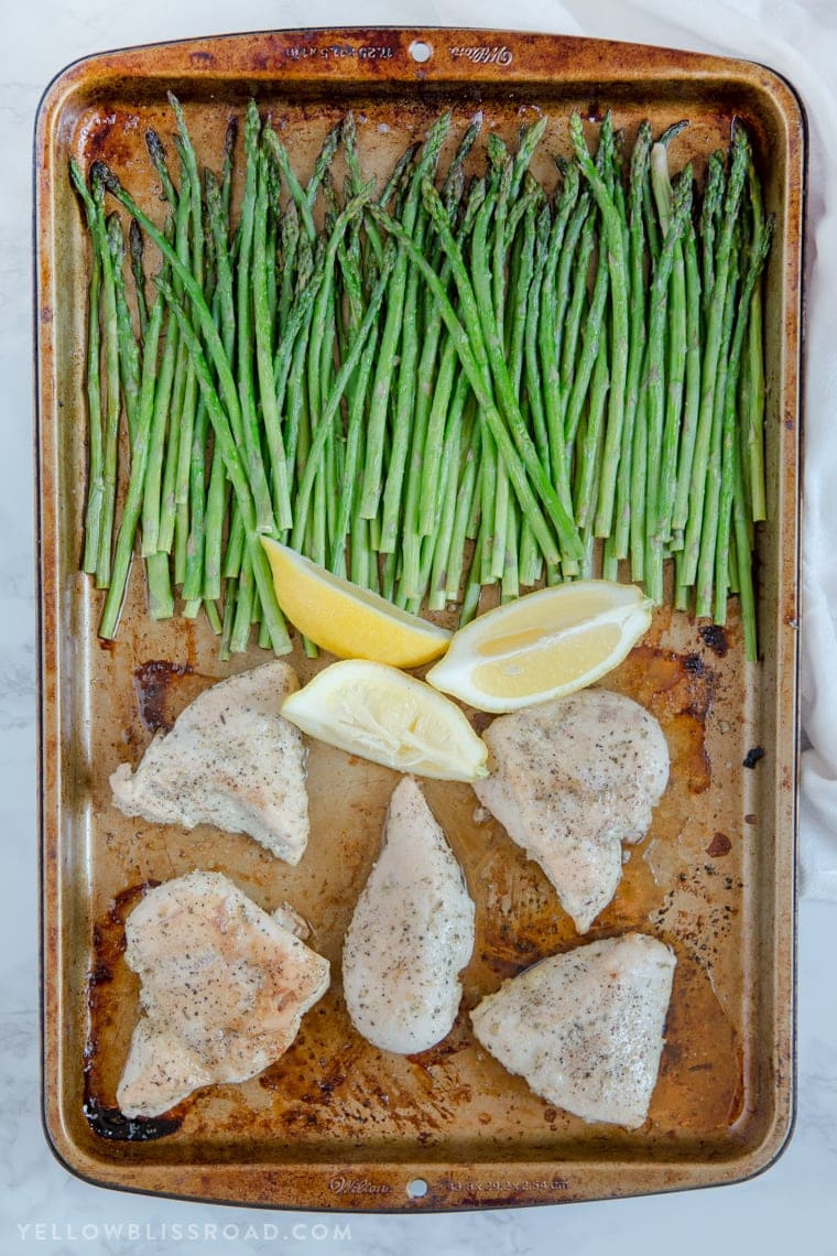 This Lemon Herb Chicken & Asparagus Sheet Pan Dinner is a delicious and healthy one pan meal that is perfect for busy weeknights!