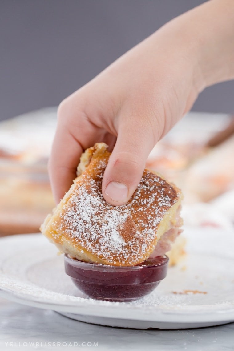 Monte Cristo Sandwich Sliders are the classic sandwich, in "mini" form. Perfect for parties, or just when you want something delicious and a little different and fun. Monte Cristo Sandwich Sliders dipped in jelly