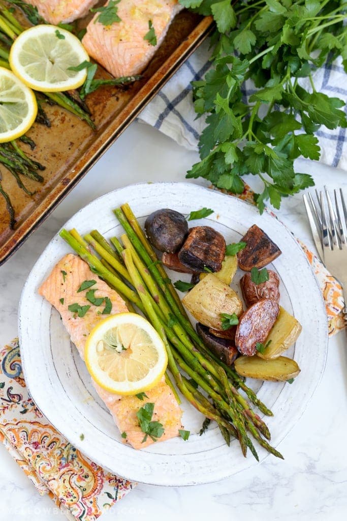 A plate of salmon and potatoes on a table