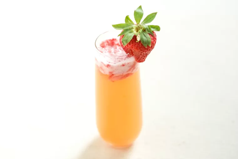 This Pineapple Strawberry Mimosa is crisp and refreshing and perfect for brunch! It's a stand-by classic with a sweet, fun twist.