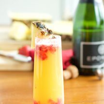 Pineapple Strawberry Mimosa- Nothing says brunch like the perfect mimosa! Try this twist on your classic mimosa and fall in love!