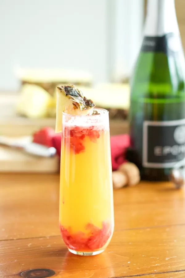 This Pineapple Strawberry Mimosa is crisp and refreshing and perfect for brunch! It's a stand-by classic with a sweet, fun twist.