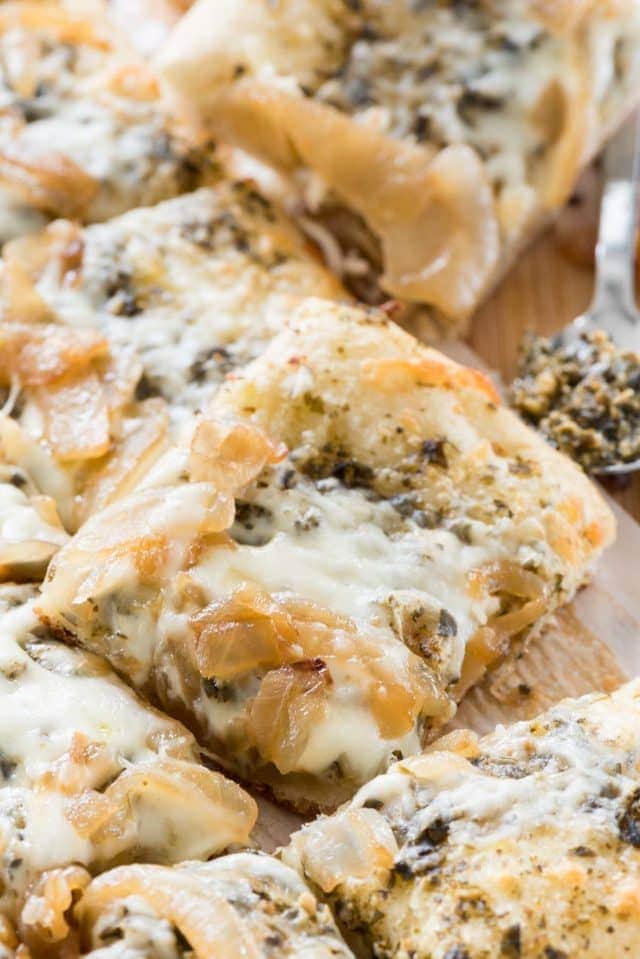 A close up of pesto flatbread