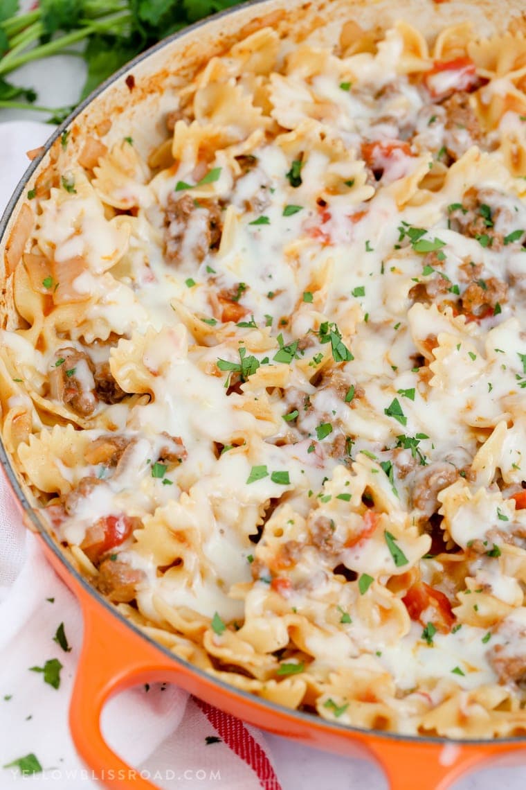 This Cheesy Beef & Tomato Pasta Skillet is sure to become your new favorite meal. All cooked in one pan, this easy weeknight dinner comes together in less than 30 minutes!