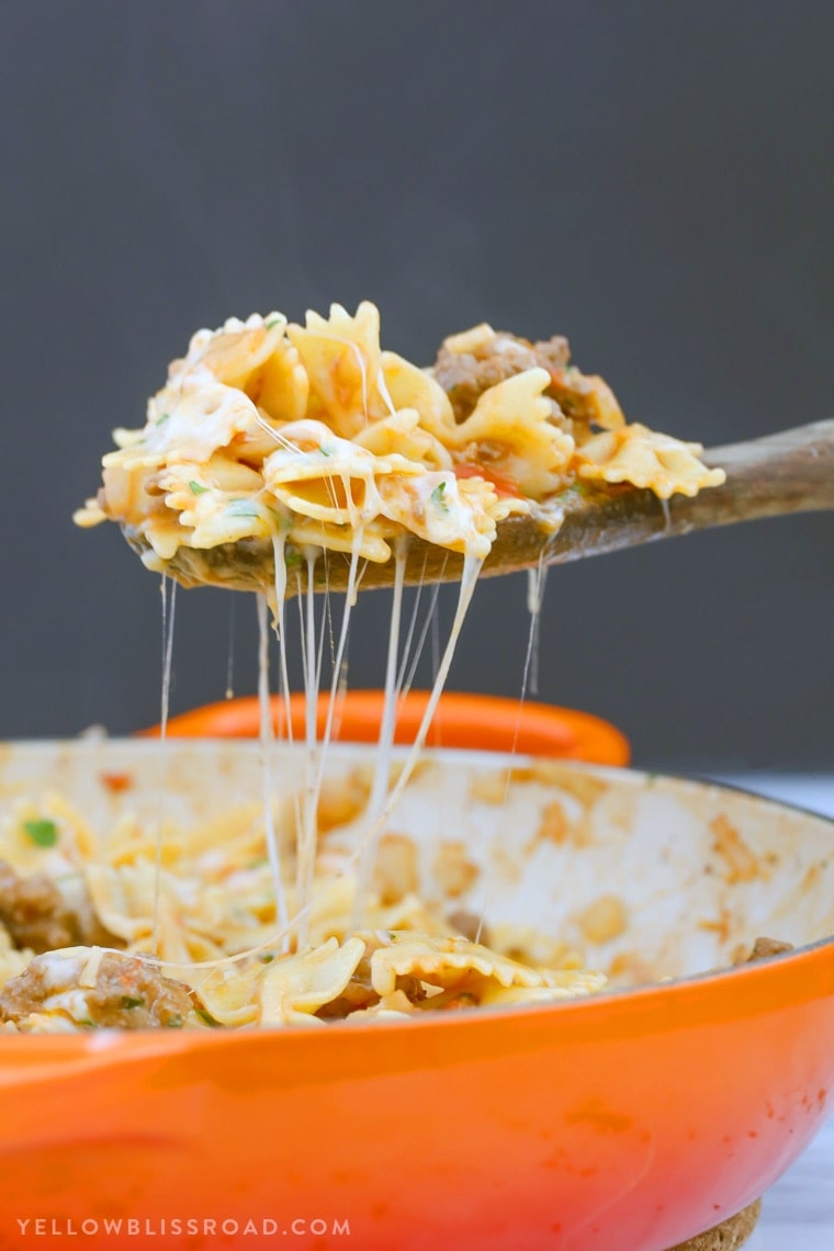 This Cheesy Beef & Tomato Pasta Skillet is sure to become your new favorite meal. All cooked in one pan, this easy weeknight dinner comes together in less than 30 minutes!