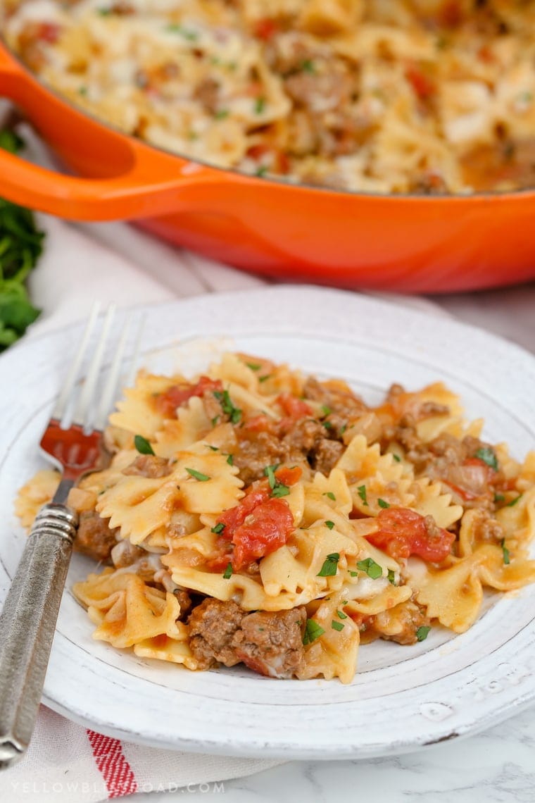 This Cheesy Beef & Tomato Pasta Skillet is sure to become your new favorite meal. All cooked in one pan, this easy weeknight dinner comes together in less than 30 minutes!